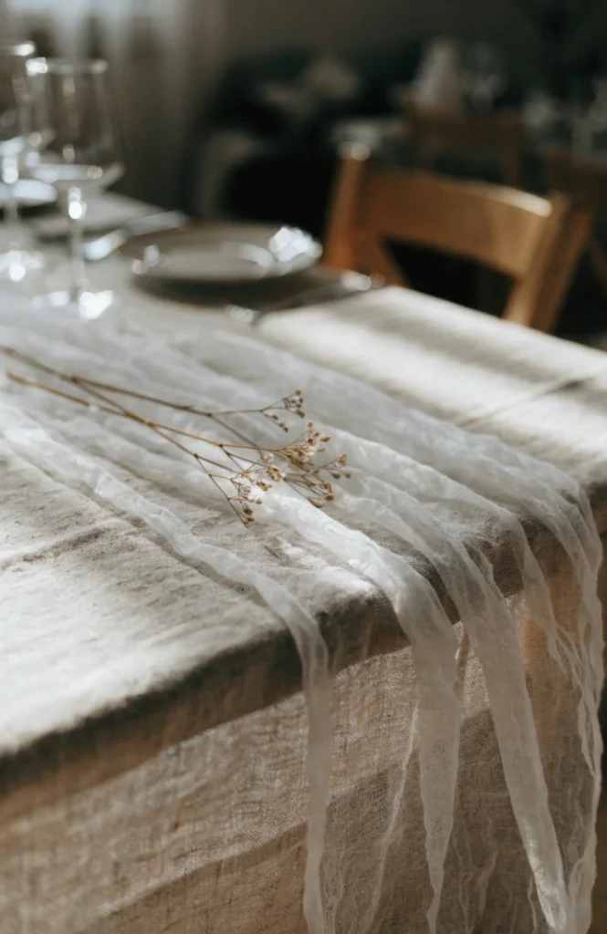 Layer a Natural Linen Cloth Under a Sheer Cheesecloth Runner