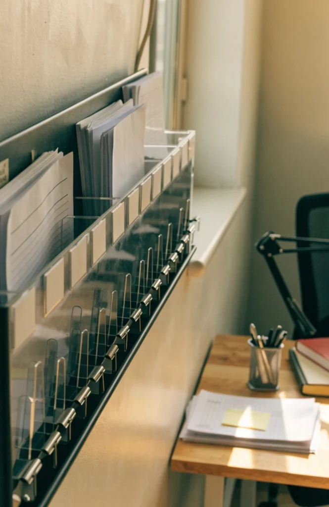 Add a wall-mounted file sorter for papers