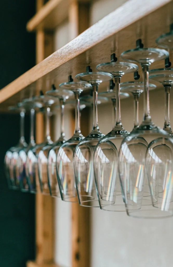 Hang stemware upside down beneath a shelf