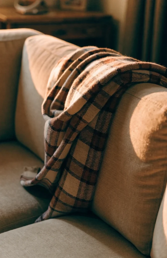 Drape a throw blanket loosely, not folded flat