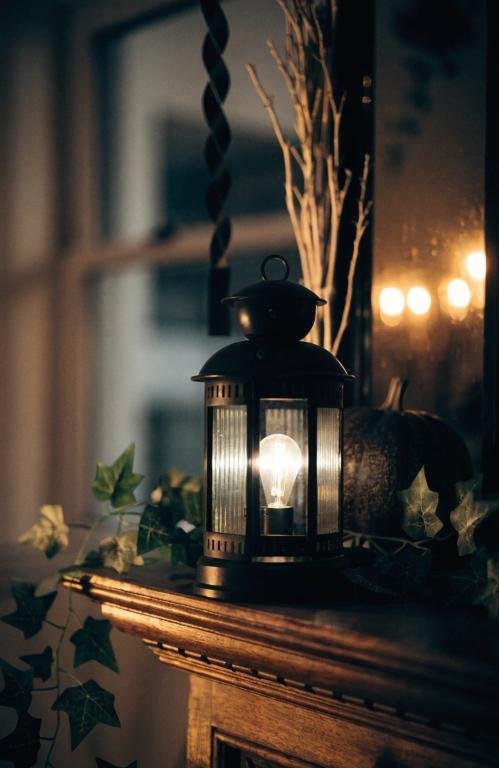 -close-up-of-a-black-metal-lantern-with-a-flicke