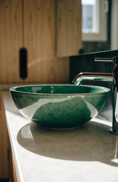 close-up-of-a-green-ceramic-vess