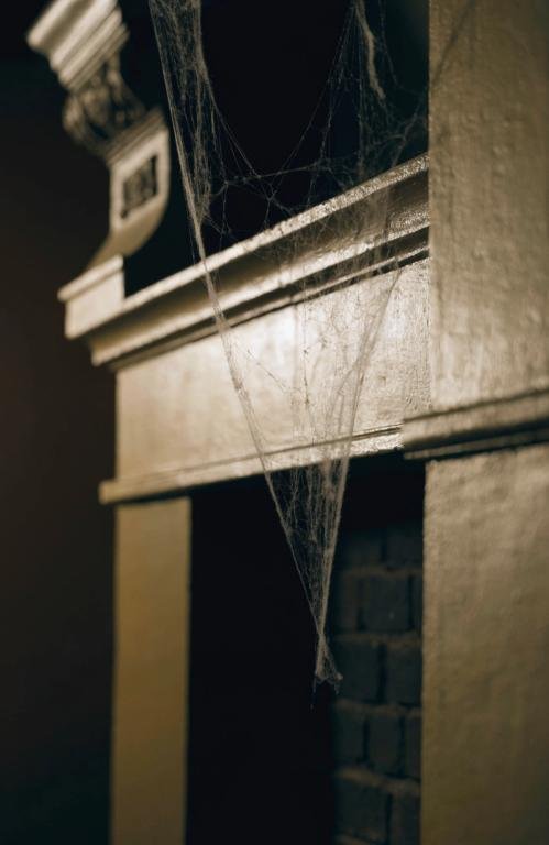 close-up-of-a-thin-faux-cobweb-garland-draped