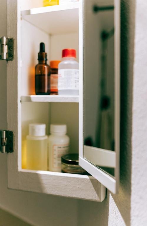 close-up-of-an-open-recessed-medicine-cabinet
