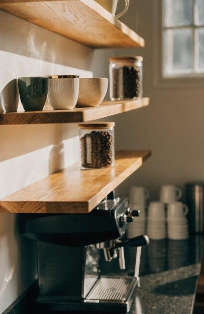 close-up-of-floating-wood-shelves-above-a-coffee-