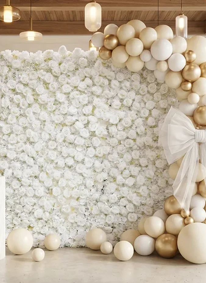 Faux flower wall panels in soft pink and white as a party photo backdrop