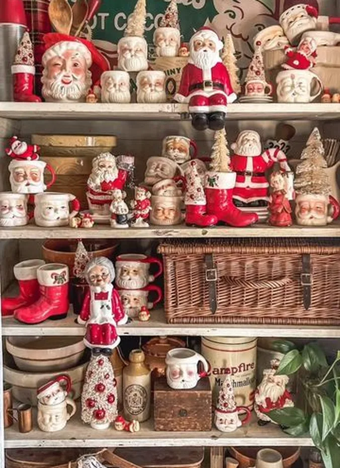 Collection of vintage ceramic Santa Claus figurines on a wooden shelf