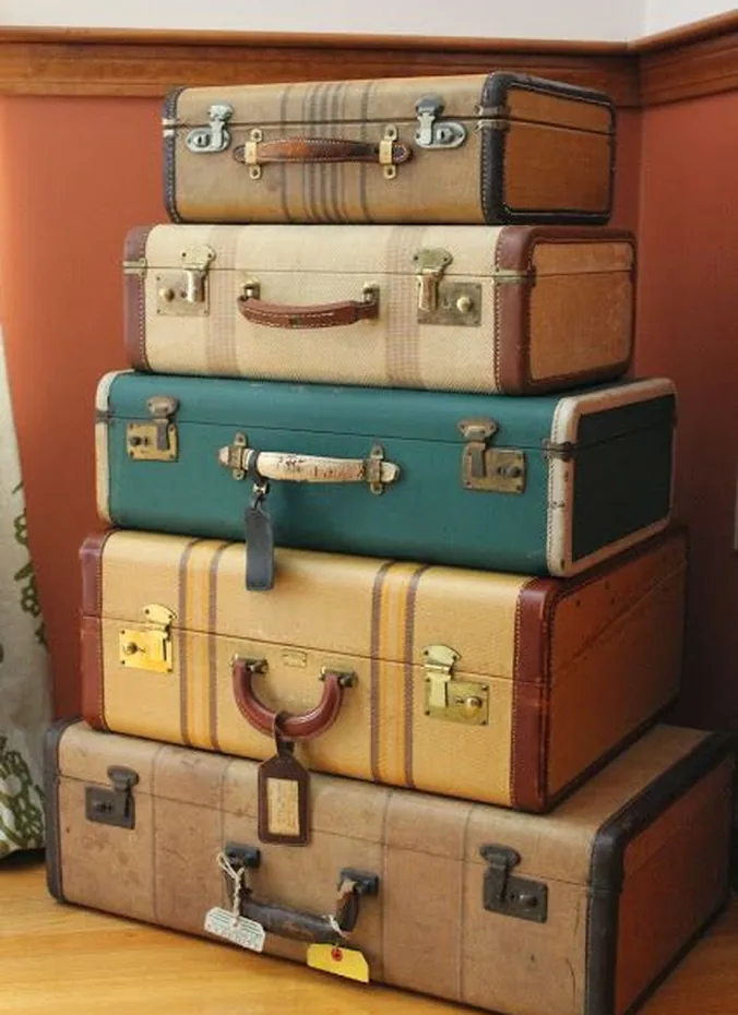 Stack of vintage suitcases with ribbon as a graduation party prop