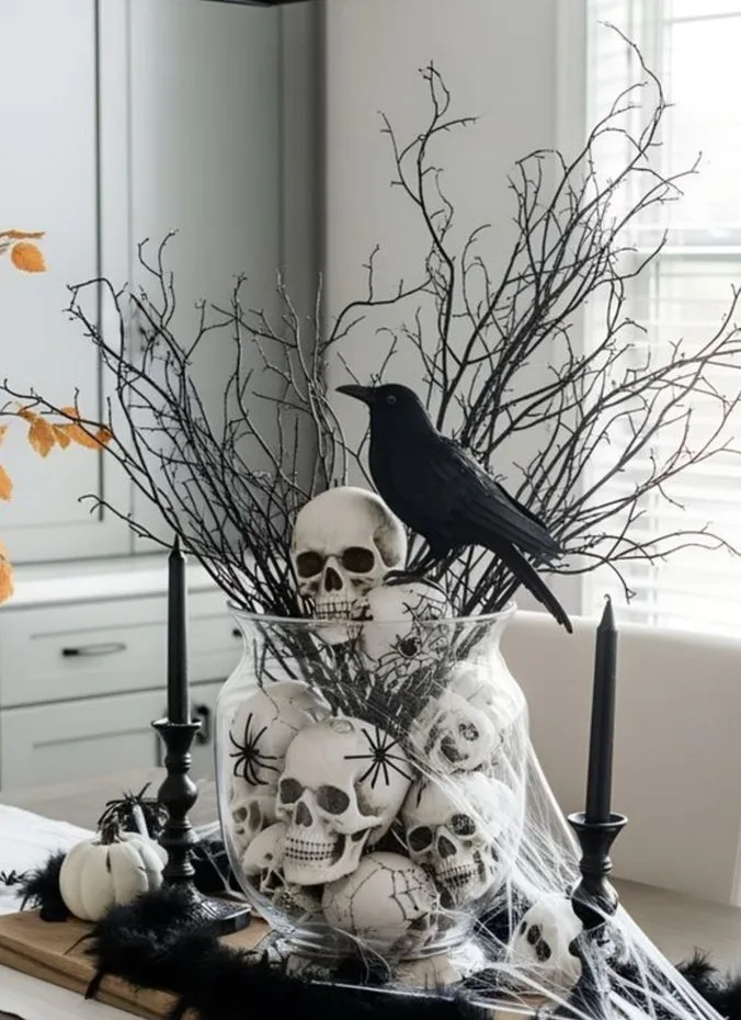 Tall vase of black feathers with a faux raven perched on top