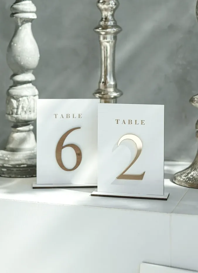 Table number cards with sweet notes on bridal shower tables