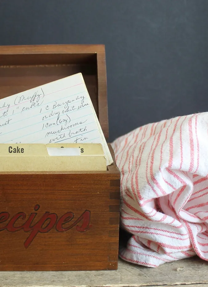 Vintage wooden recipe box with handwritten recipe cards and dividers