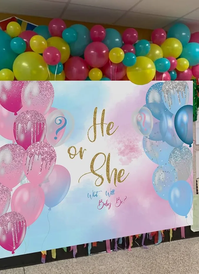 He or she banner hanging above a gender reveal party table