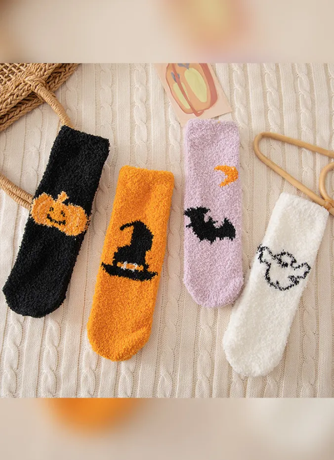 Fuzzy Halloween socks with ghost pattern folded in a pile