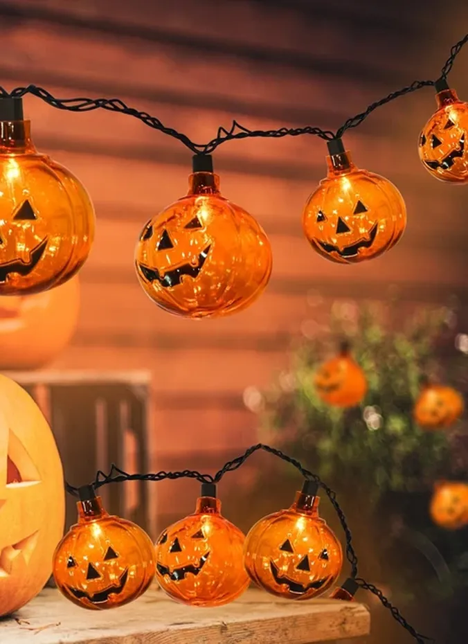 Pumpkin shaped fairy lights glowing warmly