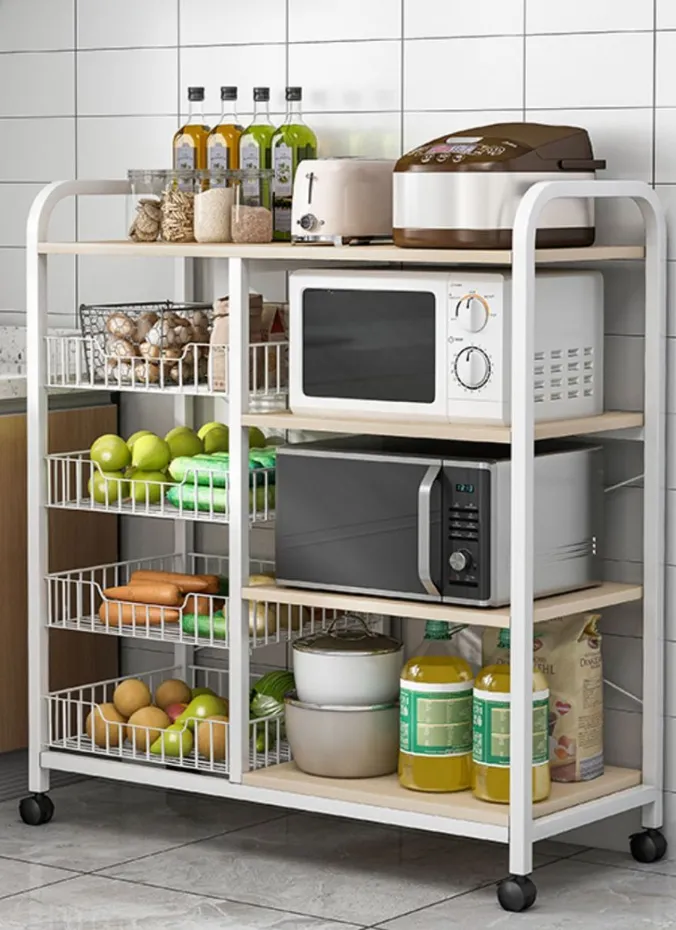 Rolling kitchen cart used for storage in a small open plan space