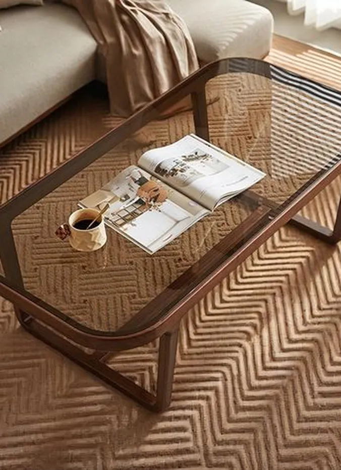 Glass coffee table keeping a small living room feeling open and airy