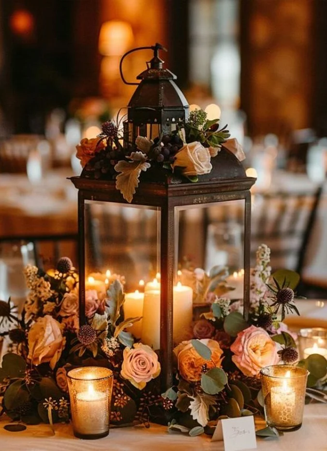 Large lantern glowing as a rustic wedding centerpiece