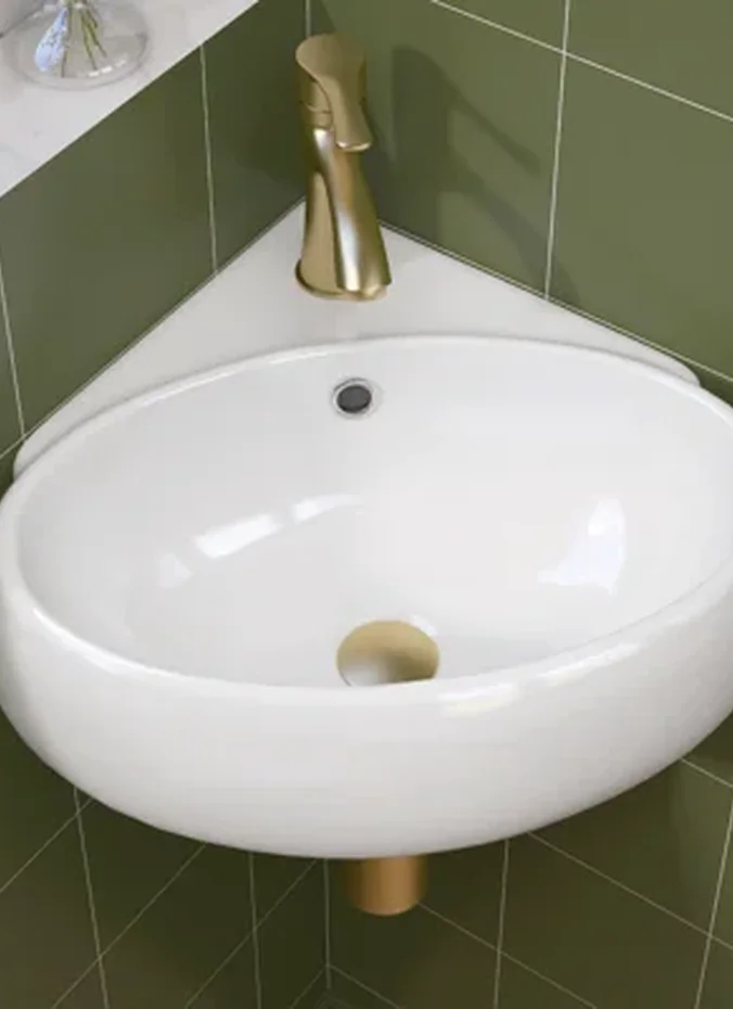 Corner sink in a small bathroom saving floor space