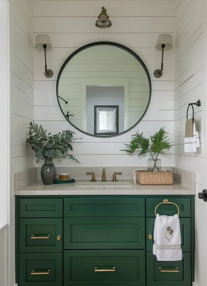 Large round mirror above a small bathroom vanity