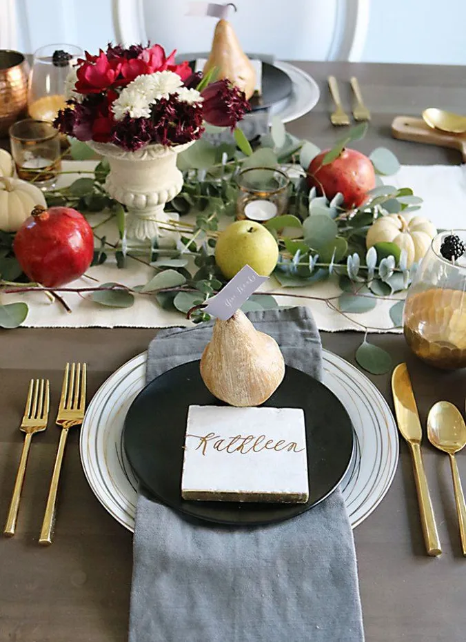 Pear used as a place card holder on a fall table