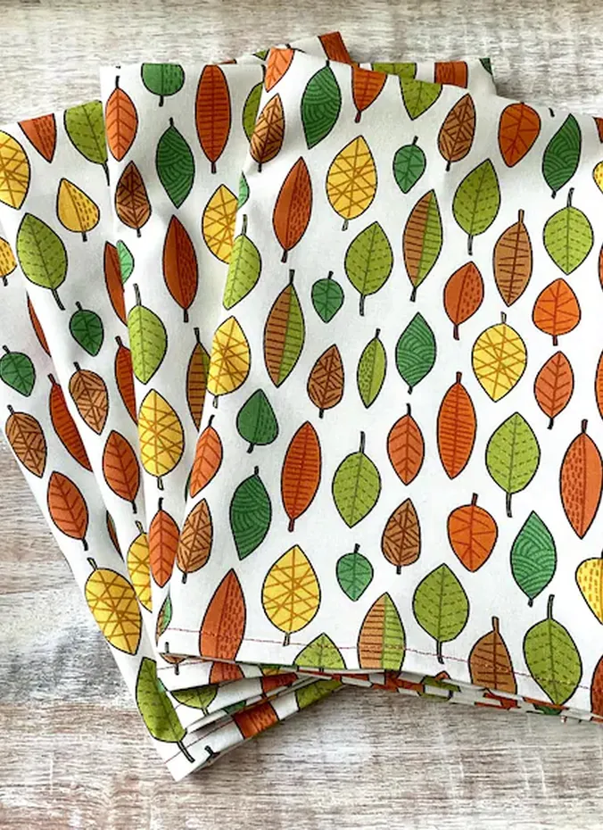 Autumn leaf print linens on a fall table