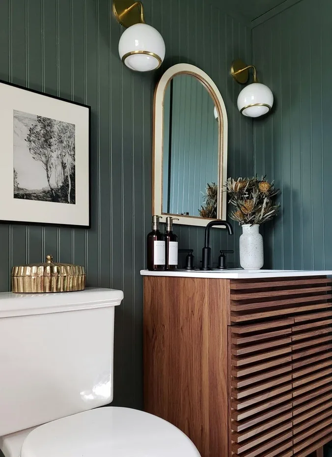 Gold lidded decorative box styled on a toilet tank