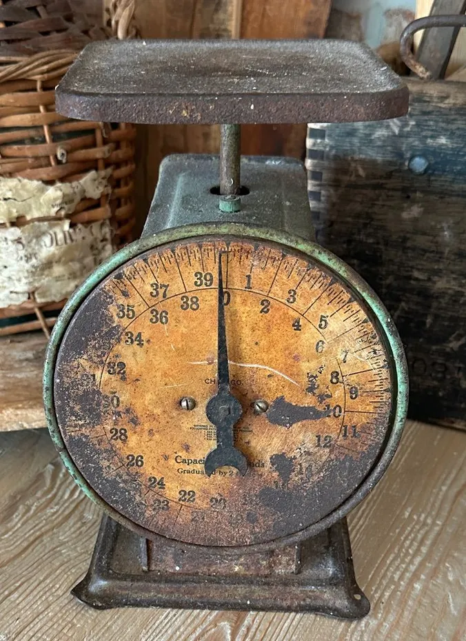 Antique kitchen scale decorated with apples for Thanksgiving