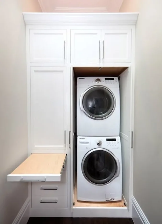 Overhead cabinet with flip up door above washer and dryer